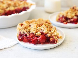 Cherry crumb pie on a plate