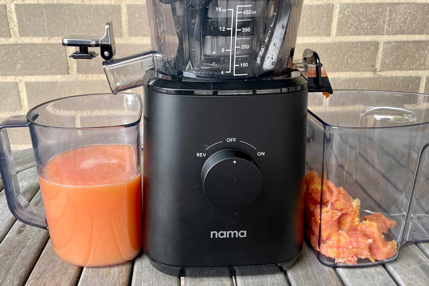 nama j2 cold press juicer after extracting juice and pulp