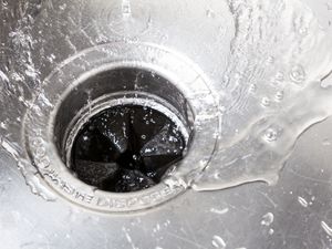 water going down drain of garbage disposal