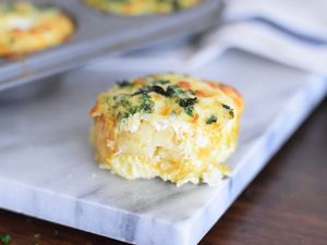 Hash brown and egg cup on a marble cutting board