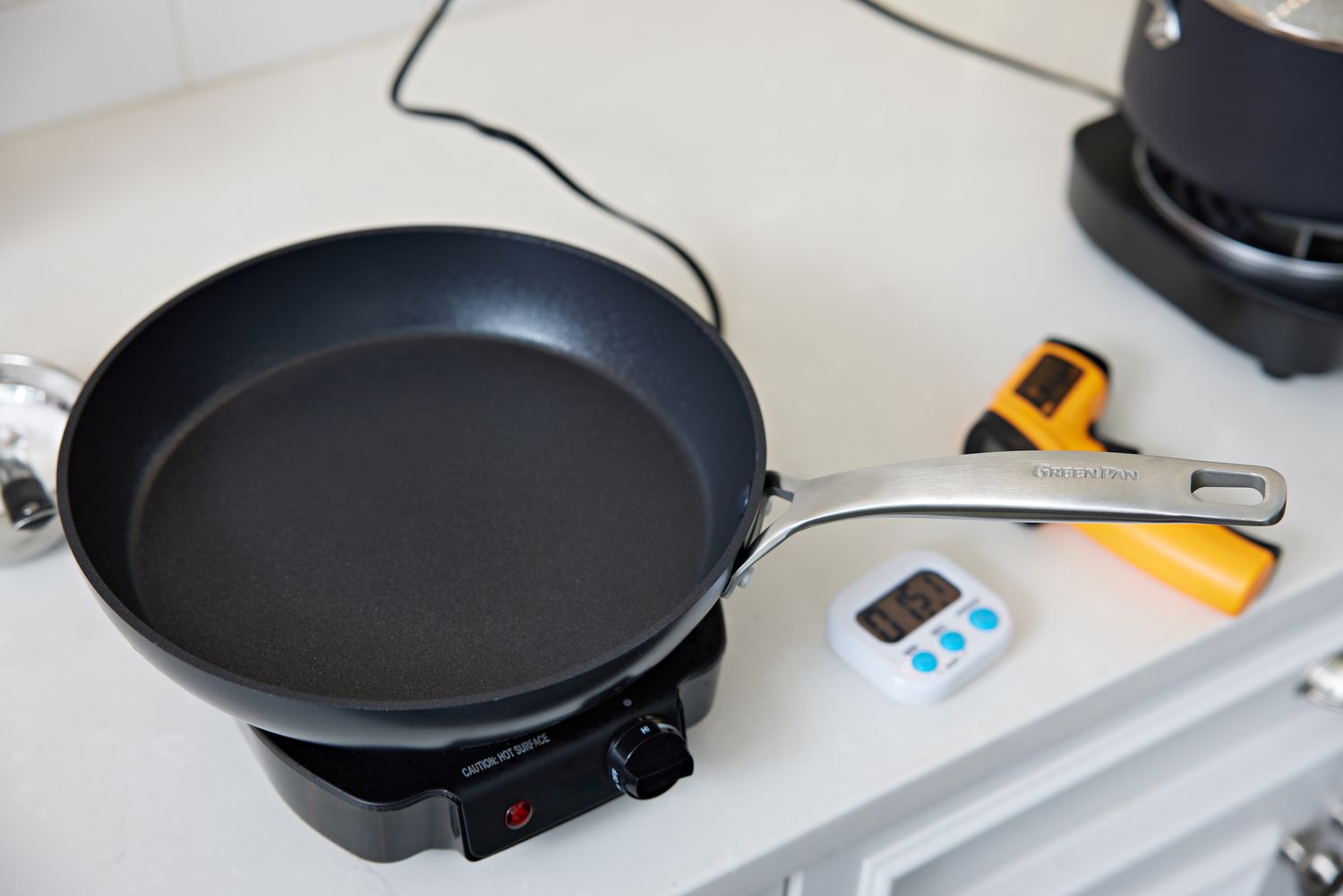 Testing the temperature of a pan during testing