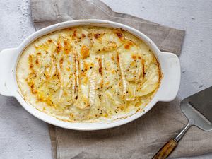 Super easy potato gratin recipe in a white casserole dish