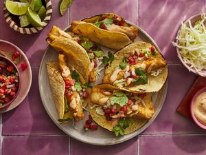 baja style fish tacos on plate with salsa