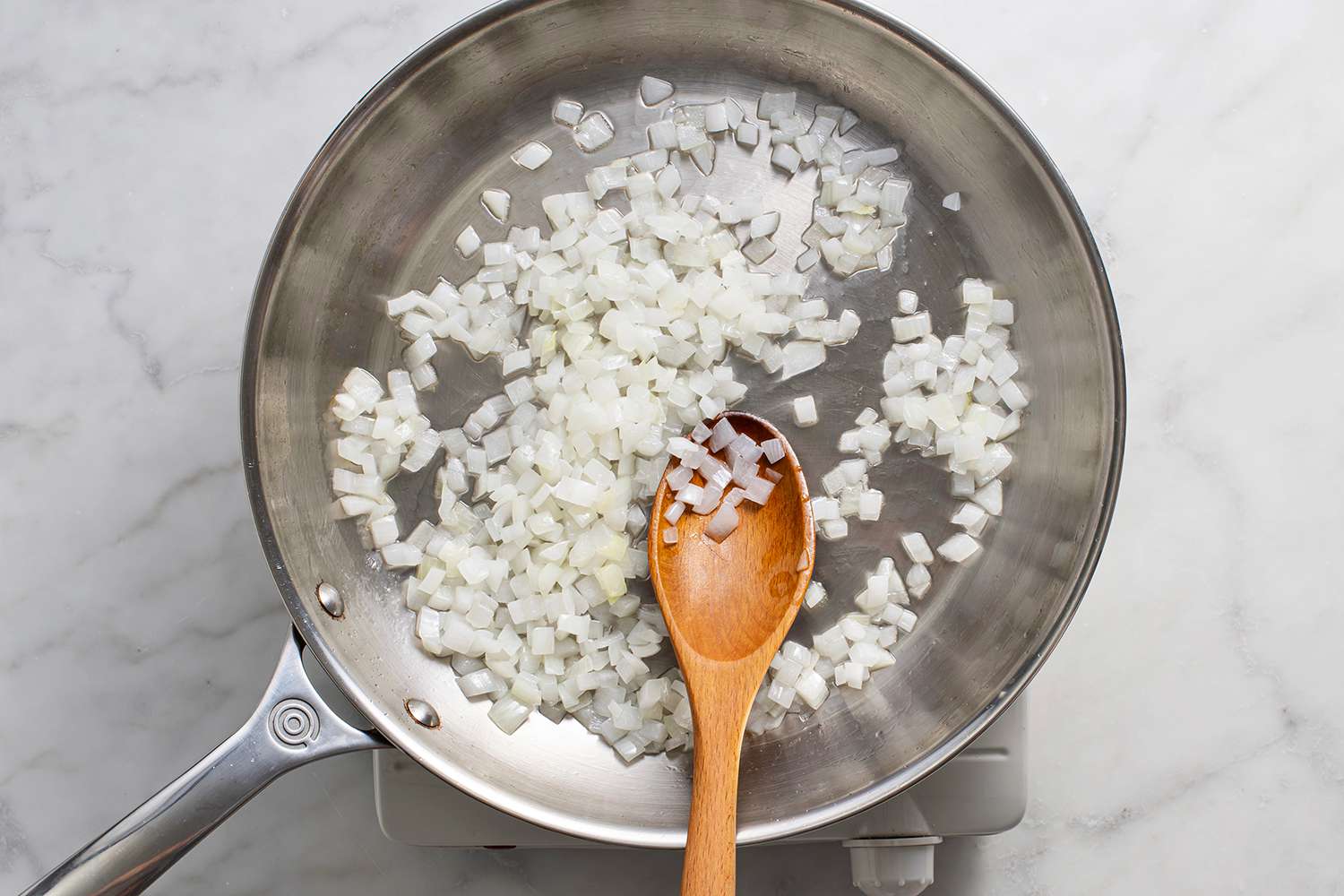 Onions cooking in a large skillet