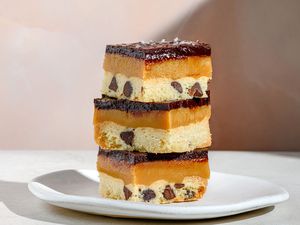 3 millionaire cooke bars stacked on a plate