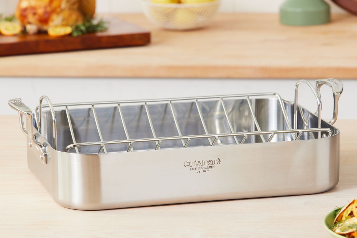 Cuisinart MultiClad Pro Stainless 16-Inch Rectangular Roaster with Rack displayed on a wood kitchen counter