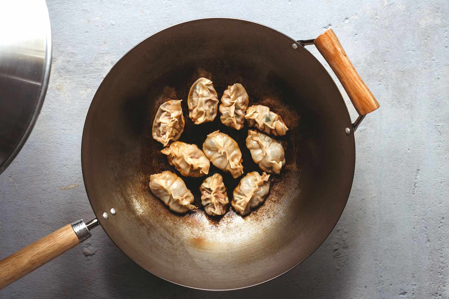 Steaming the dumplings in a wok