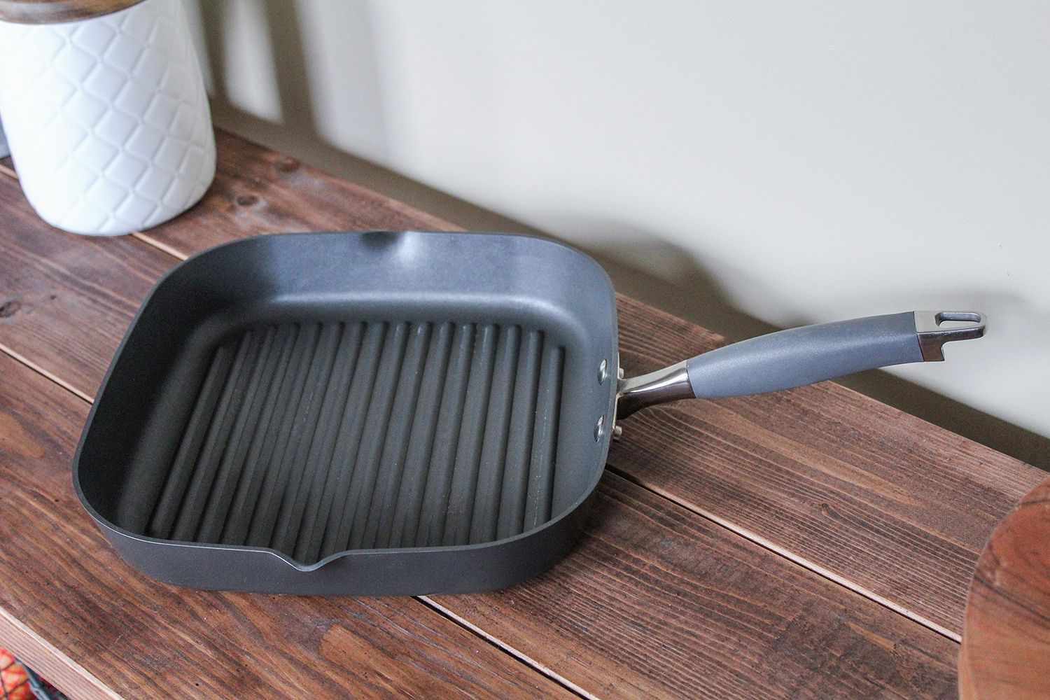 Anolon Advanced Nonstick Square Grill Pan on a wood counter