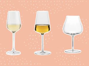 White wine glasses we recommend outlined in white and displayed on a pink background