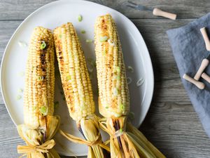 Smoked corn on the cob on a plate
