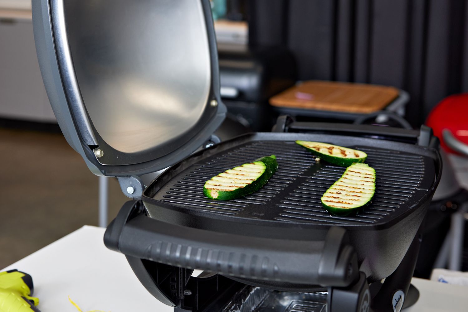 Zucchini strips grilling on the Weber Q 1400 Grill