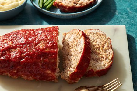 Sliced easy turkey meatloaf on a cutting board