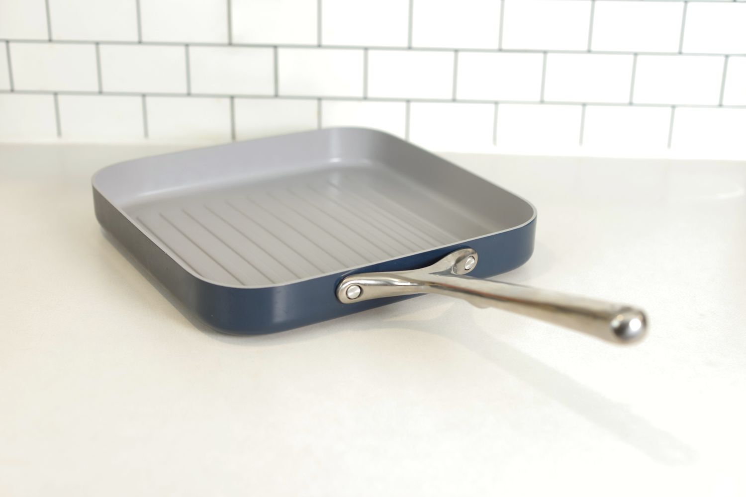 The Caraway Griddle Pan on a white countertop