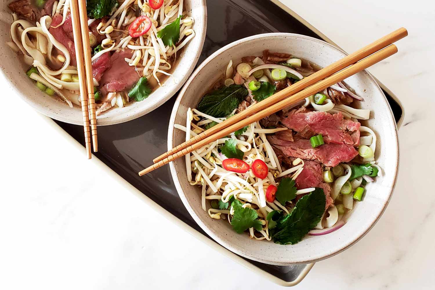Instant Pot beef pho soup in bowls.