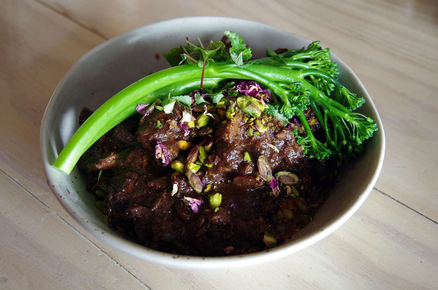 Moroccan-style lamb with pistachios and broccolini