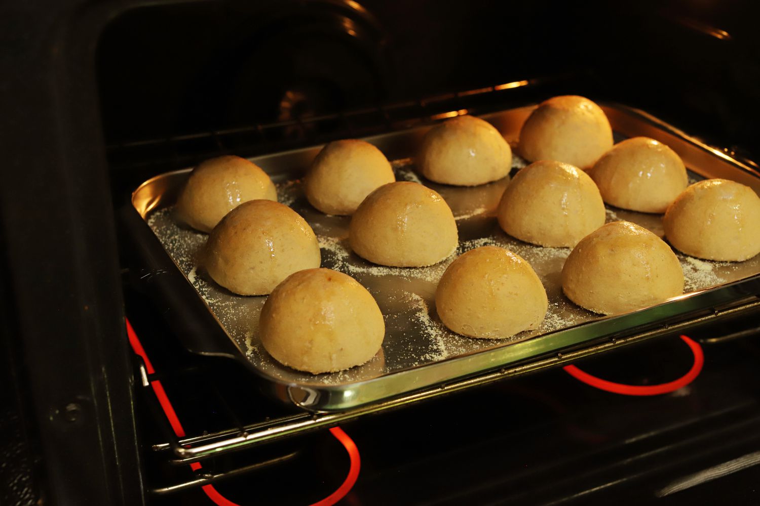 Rolls baking in the oven on the Hestan Ovenbond baking sheet