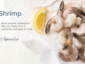 Raw shrimp and a lemon wedge