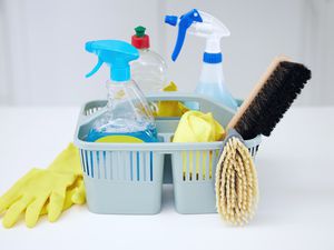 A bucket full of cleaning supplies