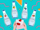 Four bottles of Clearly Canadian above a pink envelope with a letter with hearts coming out. 