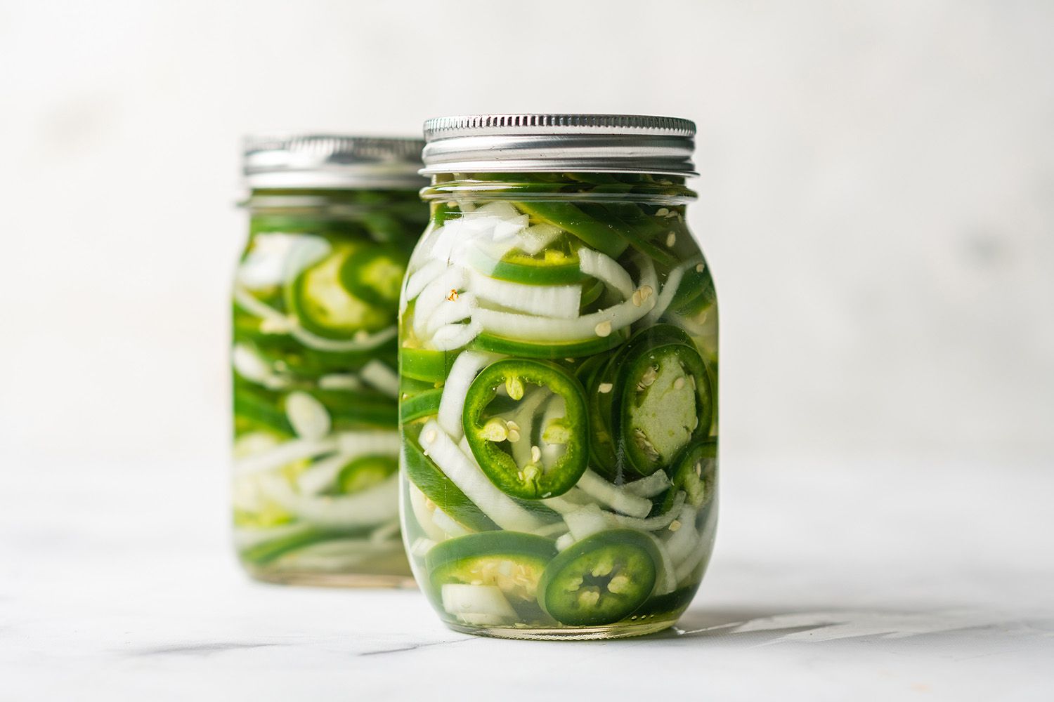 Pickled JalapeÃ±os in jars 