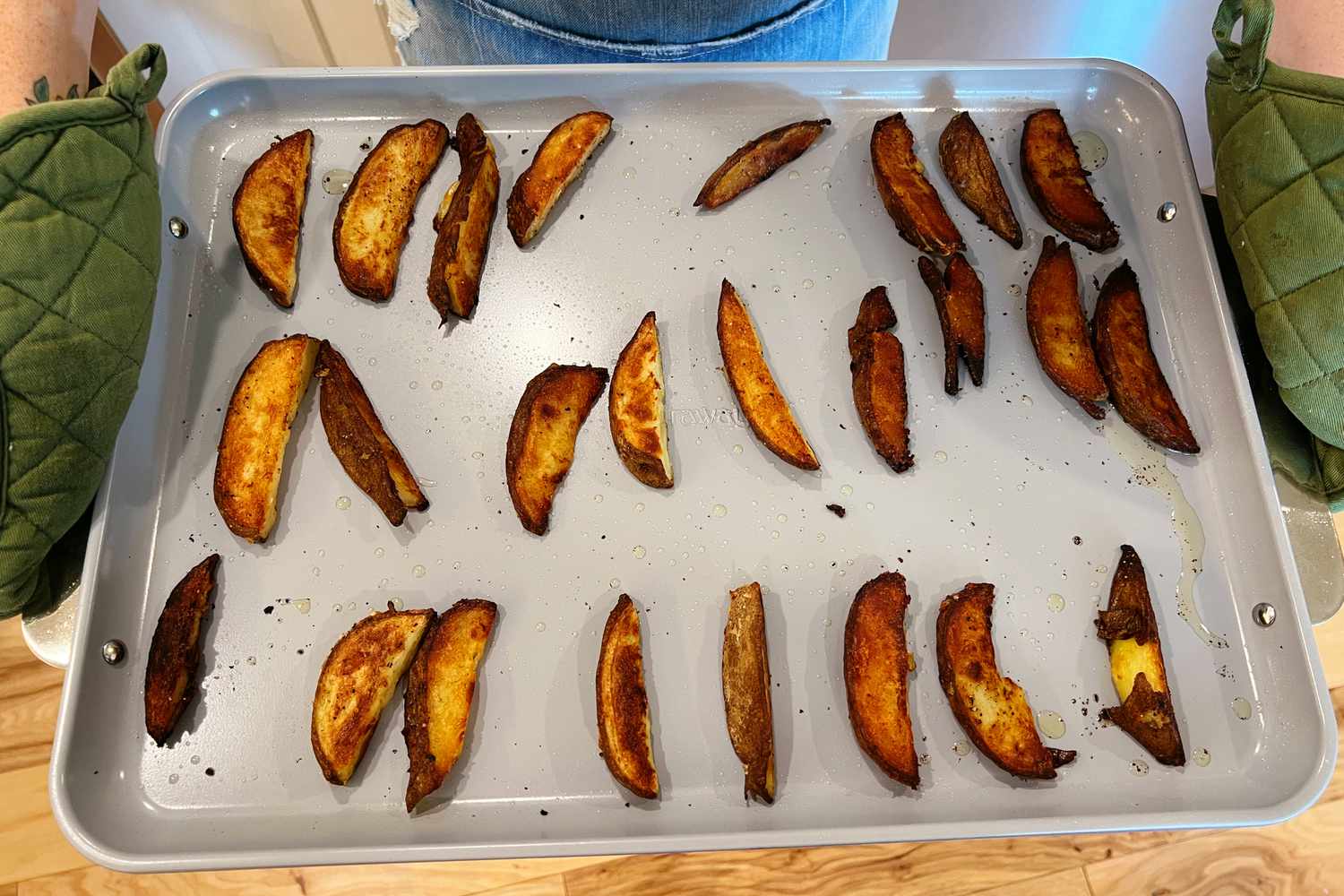 Baked potato wedges on a Caraway Baking Sheet