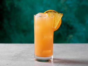 Cinderella mocktail drink with sliced orange garnish