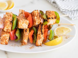 Tandoori Paneer Tikka skewers on a platter