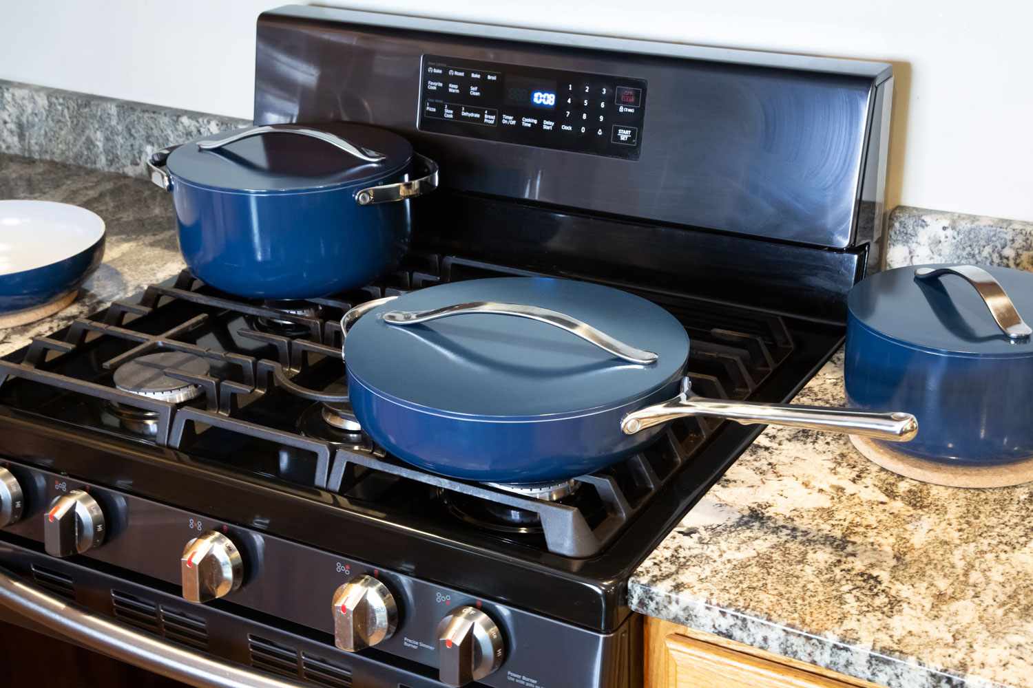 Caraway Cookware Set on a stovetop and countertop