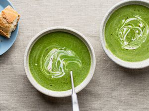 Healthy spinach soup recipe in two white bowls