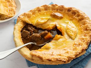 Beef and Guinness Pie with a large slice cut out