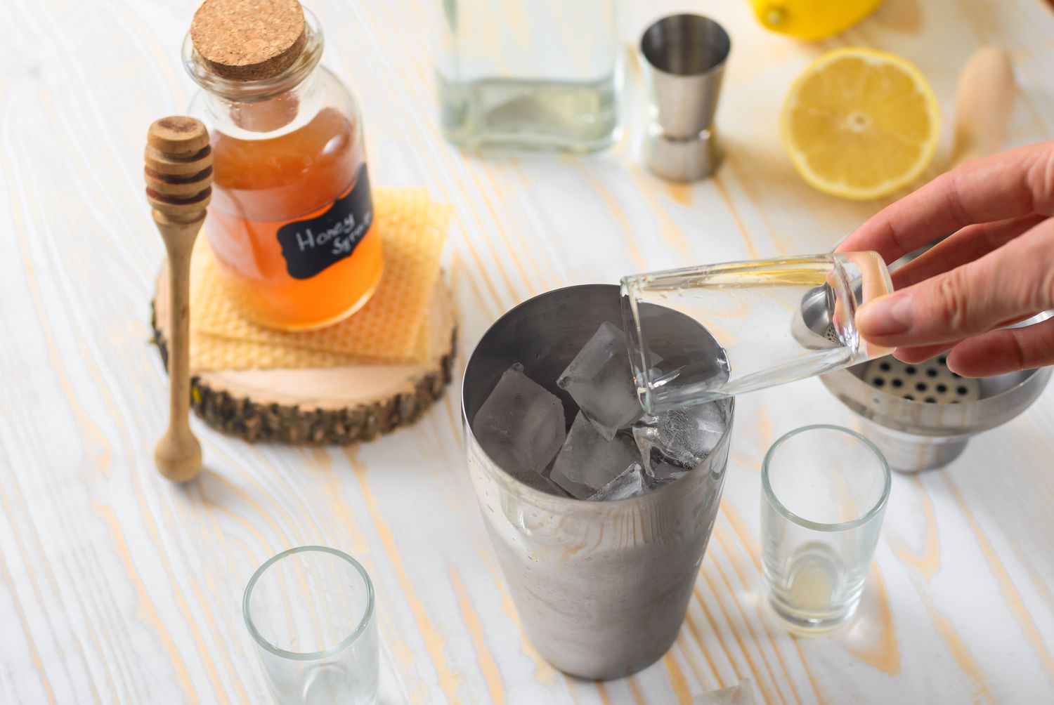 Gin being poured in a cocktail shaker