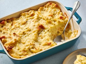 A baking dish of Pennsylvania Dutch potato filling, with a plated portion