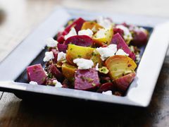 Close up of a plate of roasted beets with feta