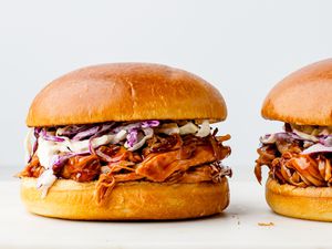 Crock pot pork shoulder with coleslaw on a bun