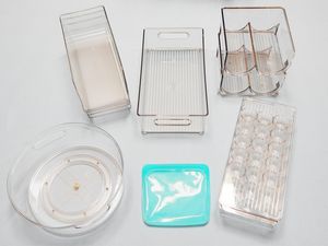 A variety of refrigerator organizers on a white surface