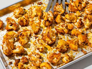 Spicy roasted cauliflower on a baking sheet