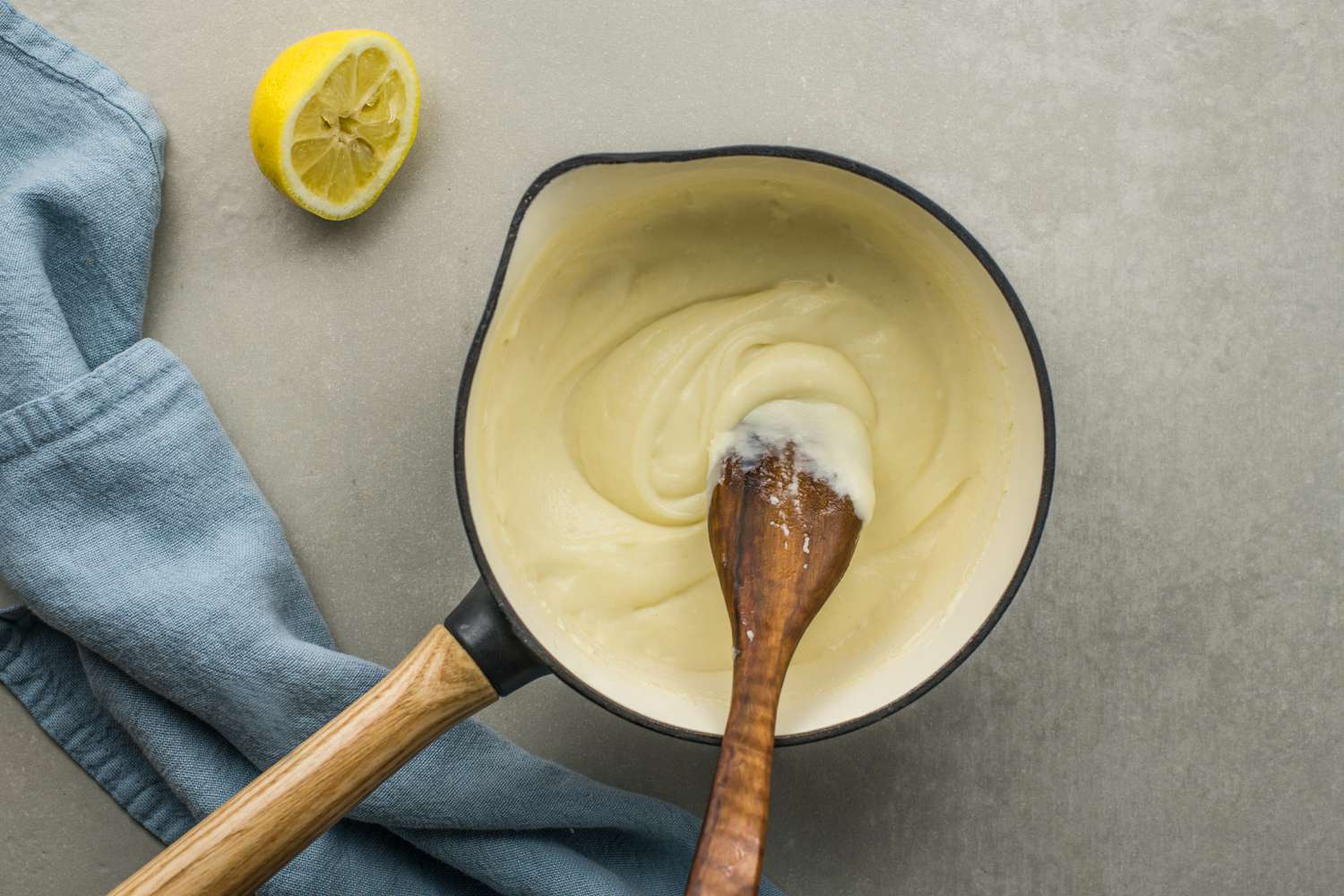 Milk and flour mixture with lemon in a pan