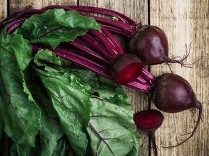 Fresh organic beetroot over wooden background