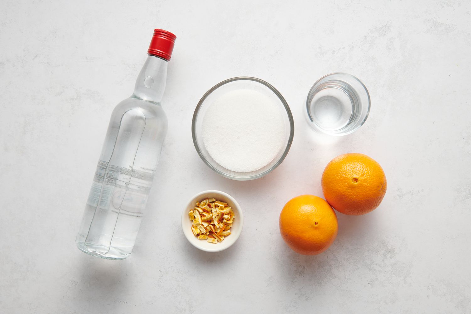 Ingredients to make homemade orange liqueur
