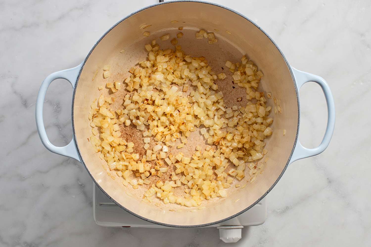 Onion cooking in a dutch oven