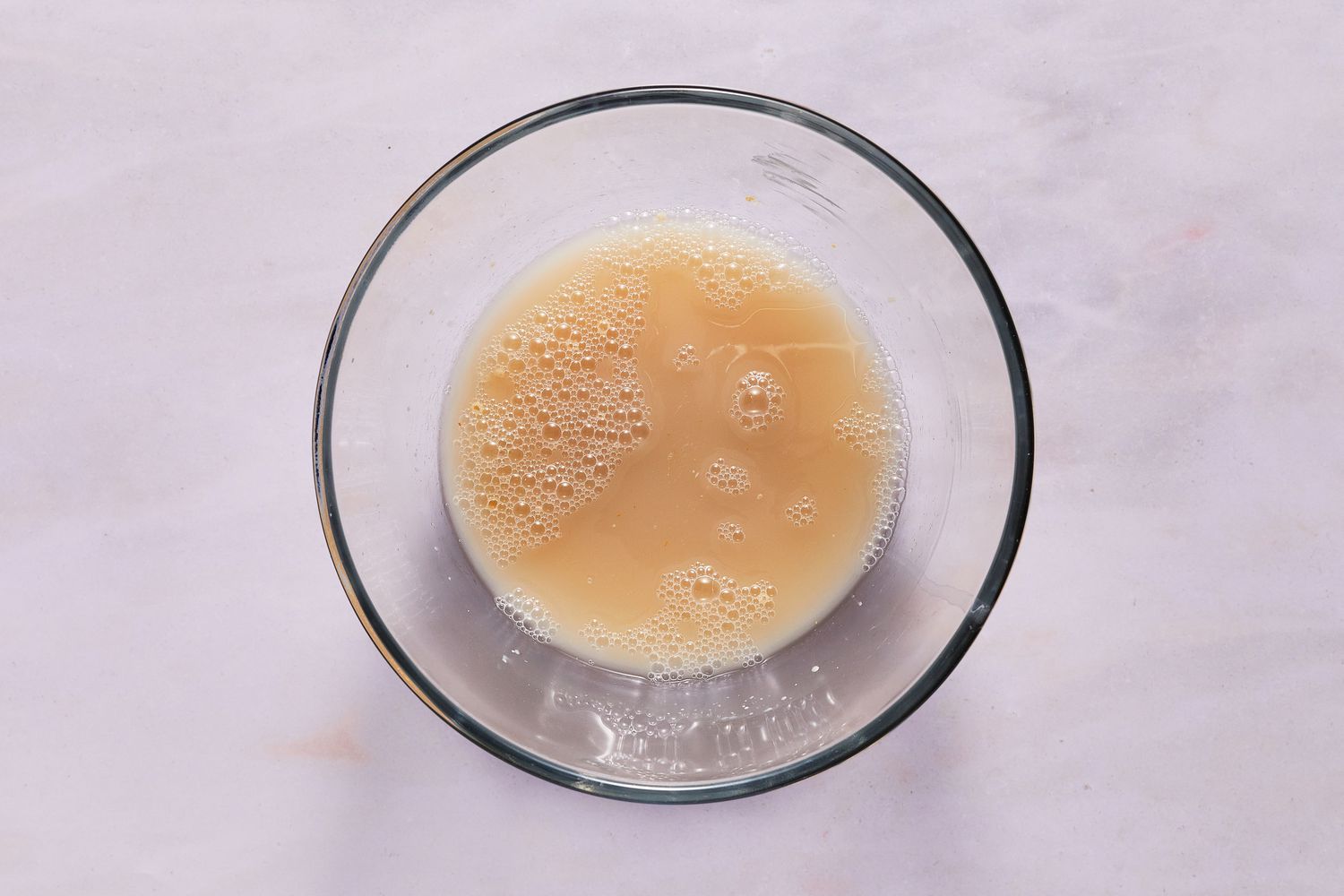 water, sugar, and yeast in a small bowl blooming