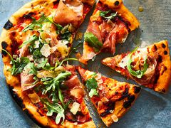 Prosciutto Pizza cut into slices.