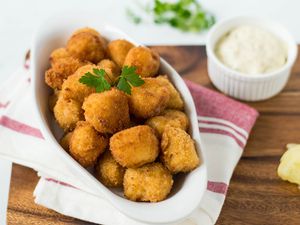 Deep-fried scallops in a white serving bowl