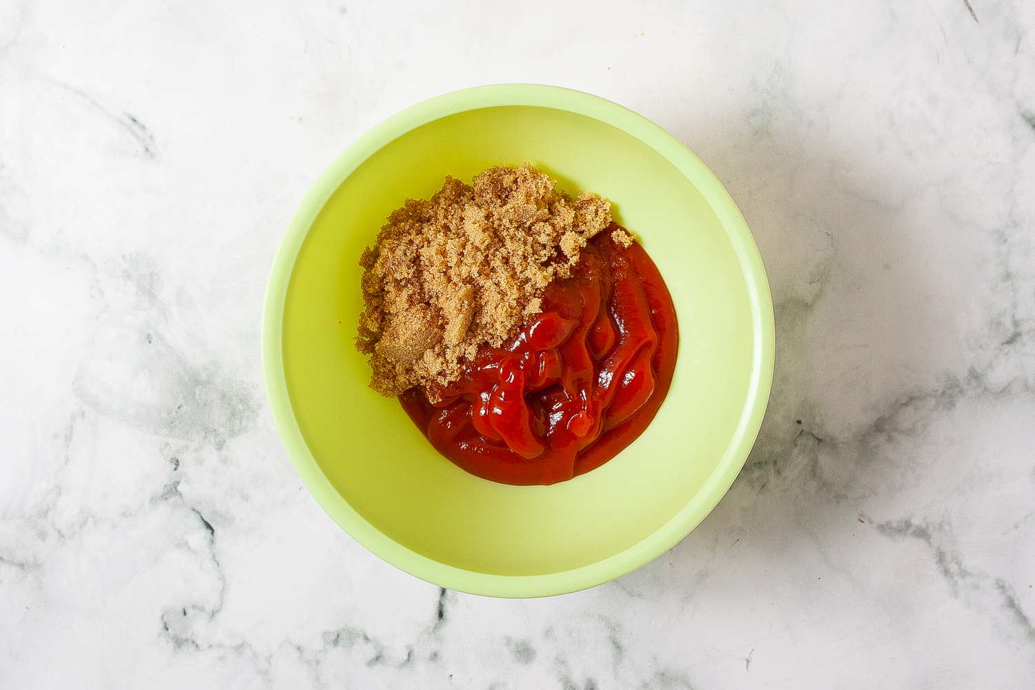 Ketchup and light brown sugar in a bowl