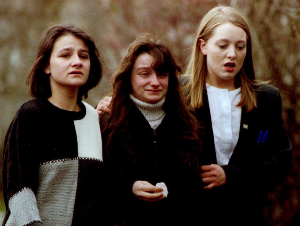  Families wait for news outside the school