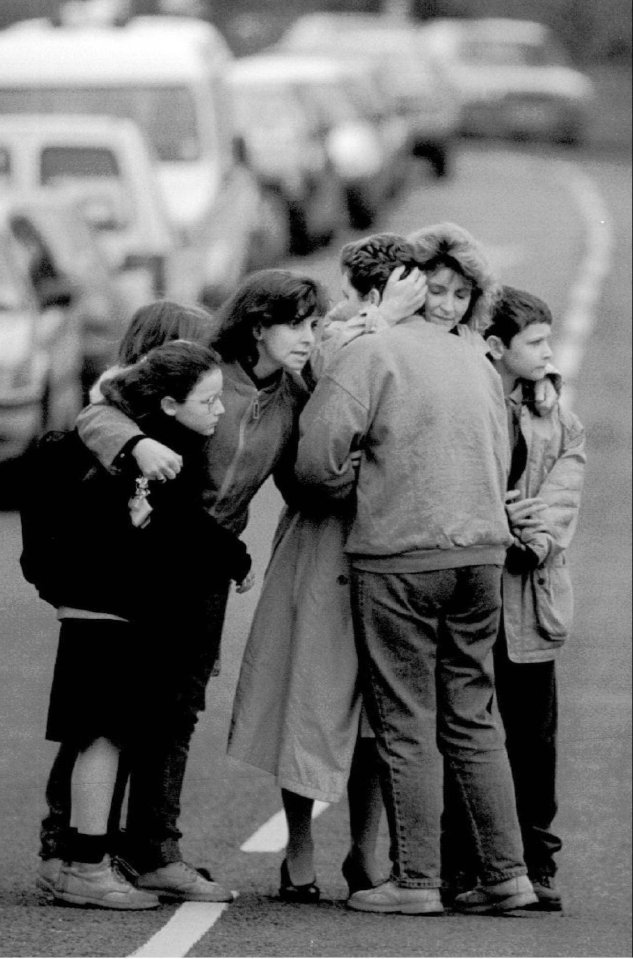  Survivors flee the school after the shooting