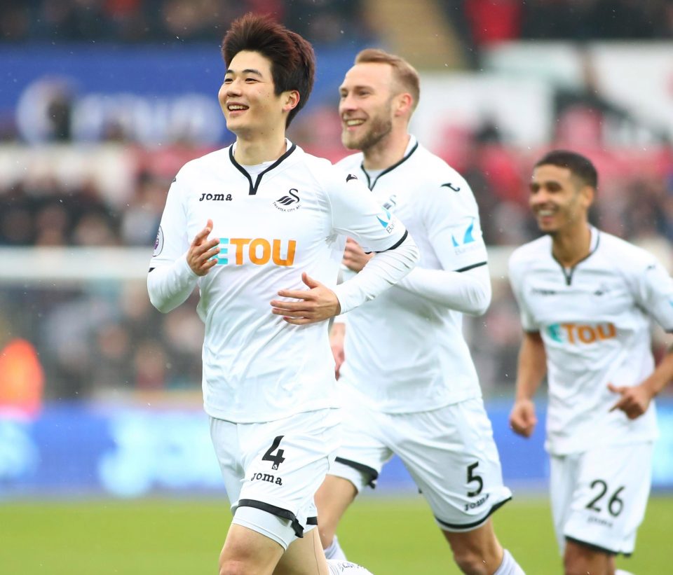  Swansea's Ki Sung-Yueng does battle against his Spurs pal Son Heung-Min this weekend in the FA Cup