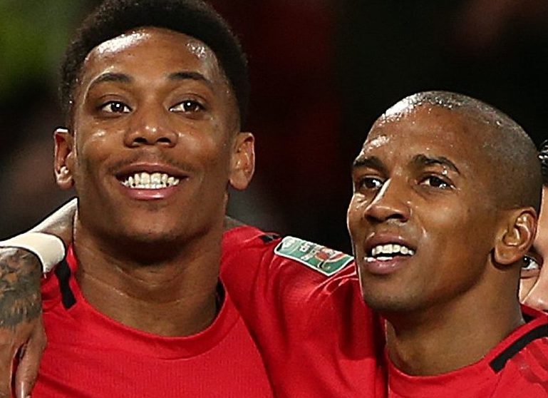  Ashley Young helps third scorer Anthony Martial celebrate as Man Utd coasted to victory