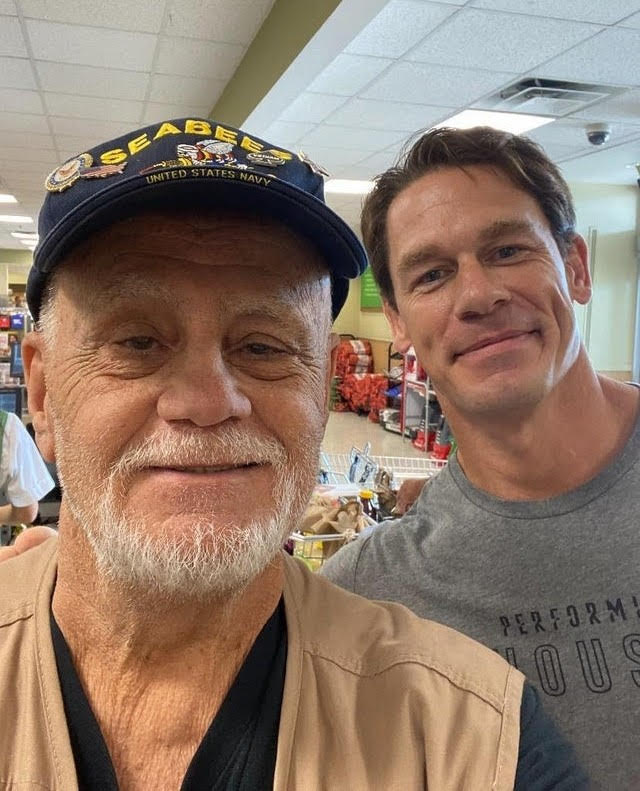  John Cena surprised a former US military veteran by paying for his shopping and then posing for a selfie during a trip to the super market