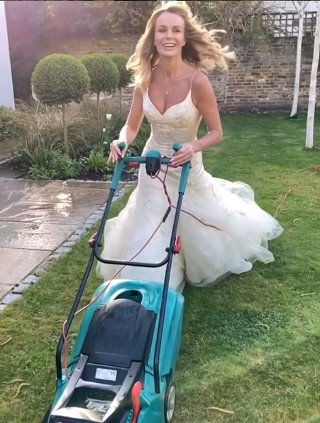 Amanda has kept her followers entertained with this comical snap mowing the lawn in her actual wedding dress